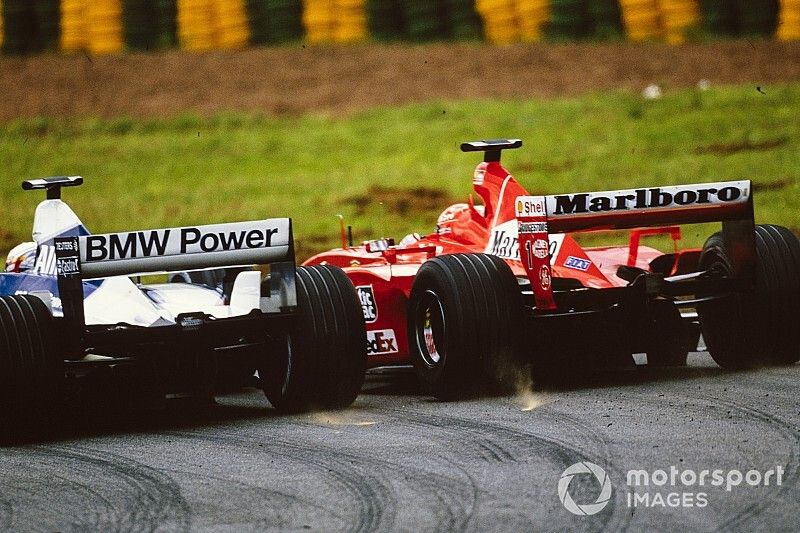 Michael Schumacher, Ferrari F2001, battles with Juan Pablo Montoya, Williams FW23 BMW