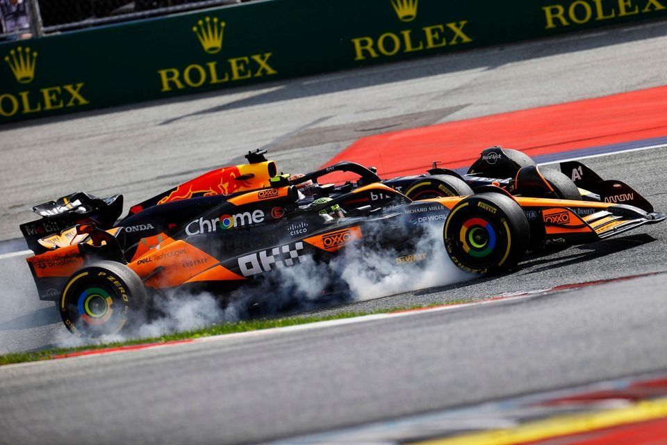Max Verstappen, Red Bull Racing RB20, Lando Norris, McLaren MCL38, make contact whilst battling for the lead of the race
