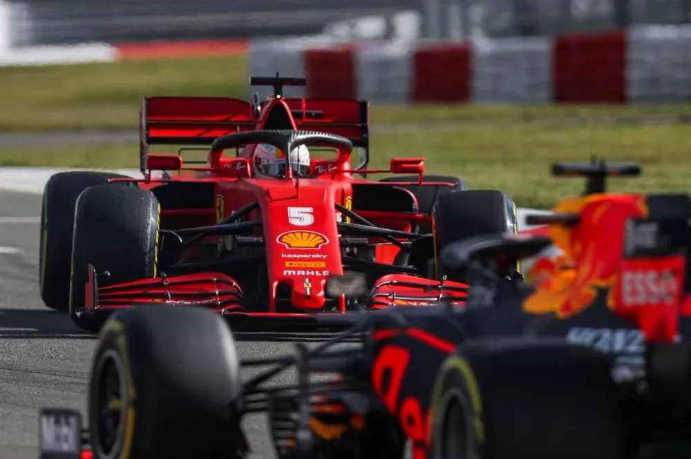 Sebastian Vettel, Ferrari SF1000, suffers a spin ahead of Max Verstappen, Red Bull Racing RB16