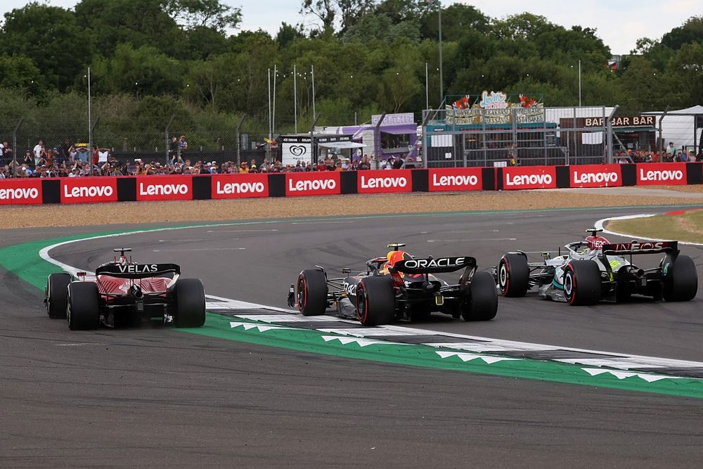Charles Leclerc, Ferrari F1-75, battles with Sergio Perez, Red Bull Racing RB18, Lewis Hamilton, Mercedes W13