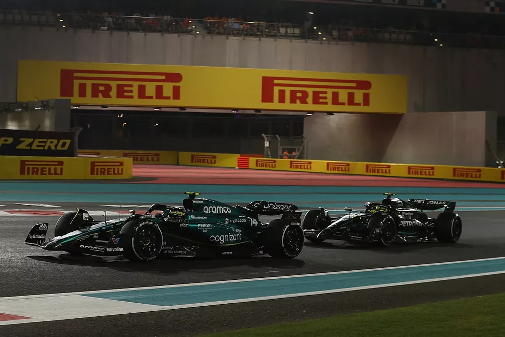 Fernando Alonso, Aston Martin AMR23, leads Sir Lewis Hamilton, Mercedes F1 W14