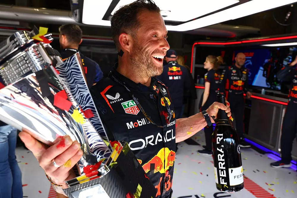 Greg Reeson, Tyre Technician at Red Bull Racing celebrates with the trophies