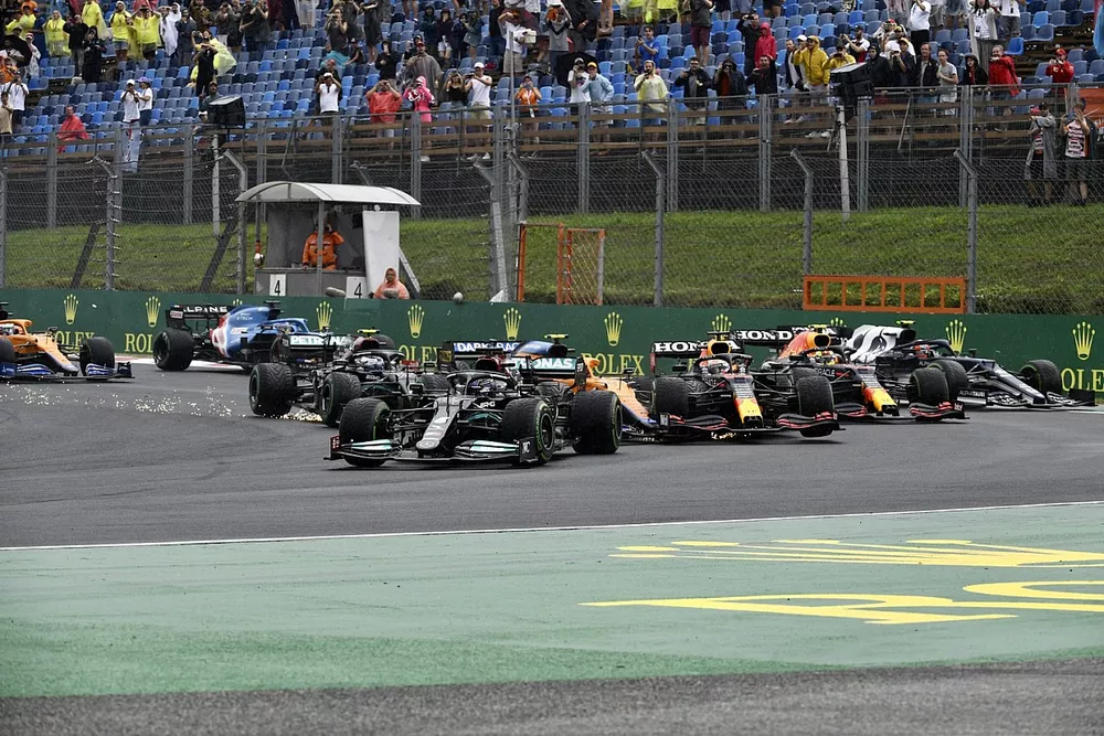 Lewis Hamilton, Mercedes W12, at the start as Valtteri Bottas, Mercedes W12, Lando Norris, McLaren MCL35M, Max Verstappen, Red Bull Racing RB16B, and Sergio Perez, Red Bull Racing RB16B, collide