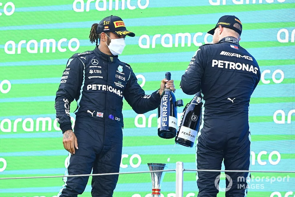 Lewis Hamilton, Mercedes, 1st position, and Valtteri Bottas, Mercedes, 3rd position, congratulate each other on the podium