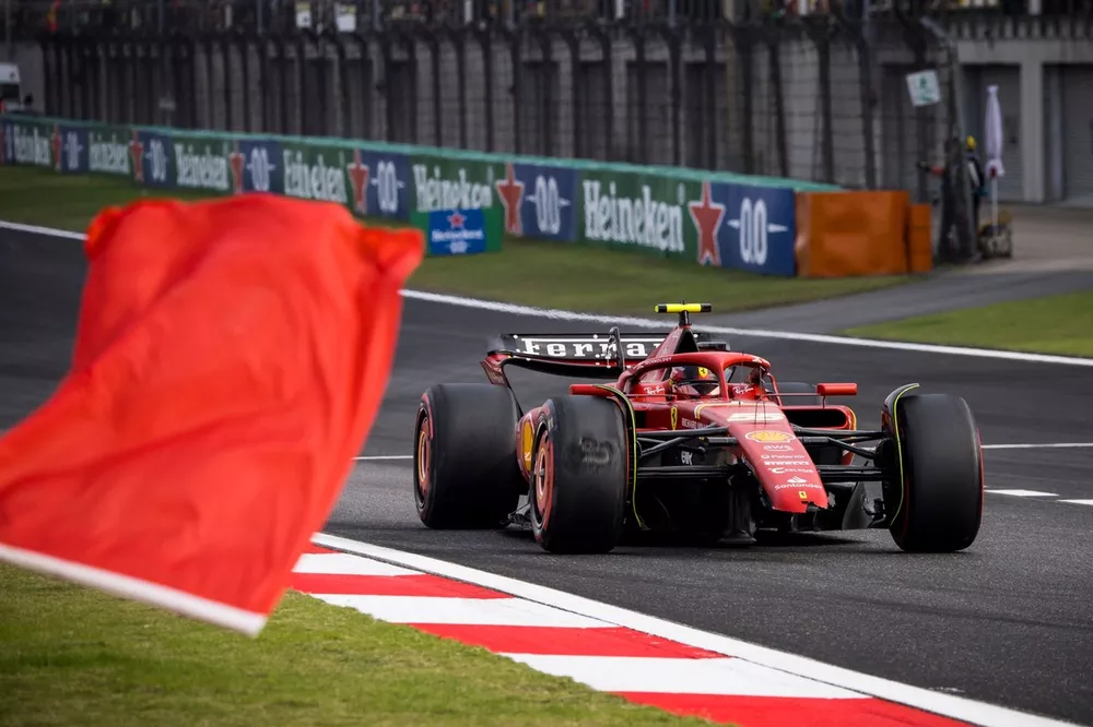 Carlos Sainz, Ferrari SF-24, heads back to the pits after a crash which caused a red flag in Q2