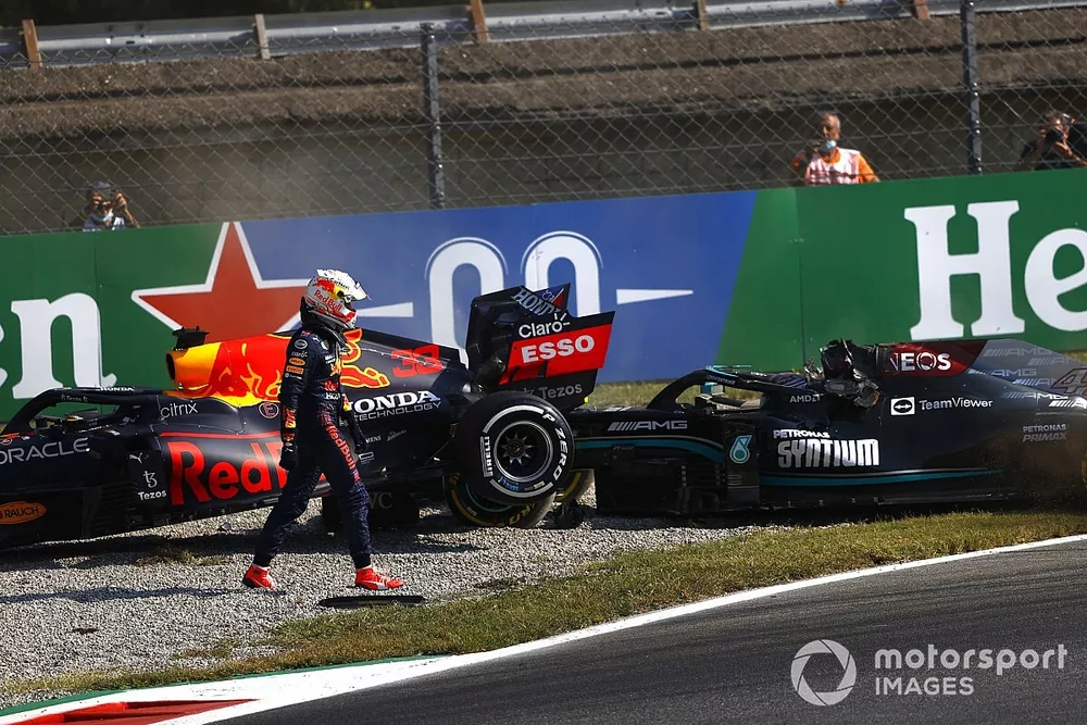 Max Verstappen, Red Bull Racing, walks away after crashing out with Lewis Hamilton, Mercedes