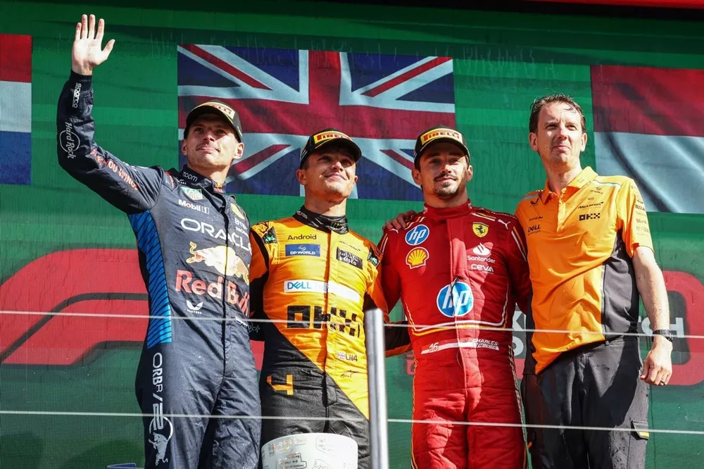 Max Verstappen, Red Bull Racing, 2nd position, Lando Norris, McLaren F1 Team, 1st position, Charles Leclerc, Scuderia Ferrari, 3rd position, the McLaren trophy delegate on the podium