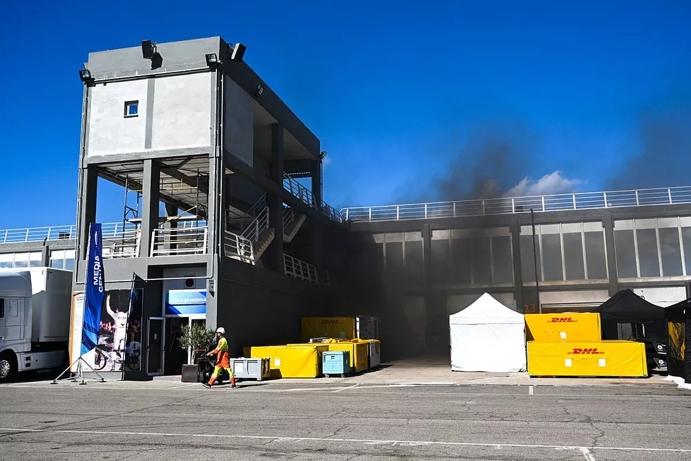 Smoke from the pit lane