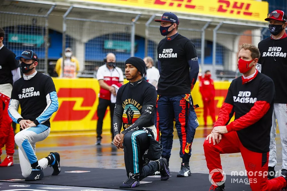 Lando Norris, McLaren, Lewis Hamilton, Mercedes-AMG F1, Max Verstappen, Red Bull Racing, Sebastian Vettel, Ferrari, and the other drivers stand and kneel in support of the End Racism camapaign