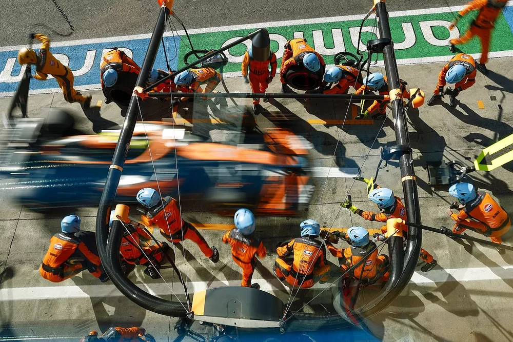 Lando Norris, McLaren MCL36, makes a pit stop