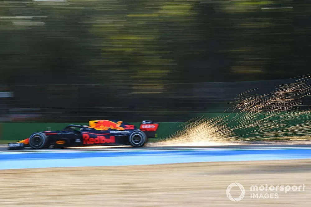 Sparks kick up from the rear of Max Verstappen, Red Bull Racing RB16