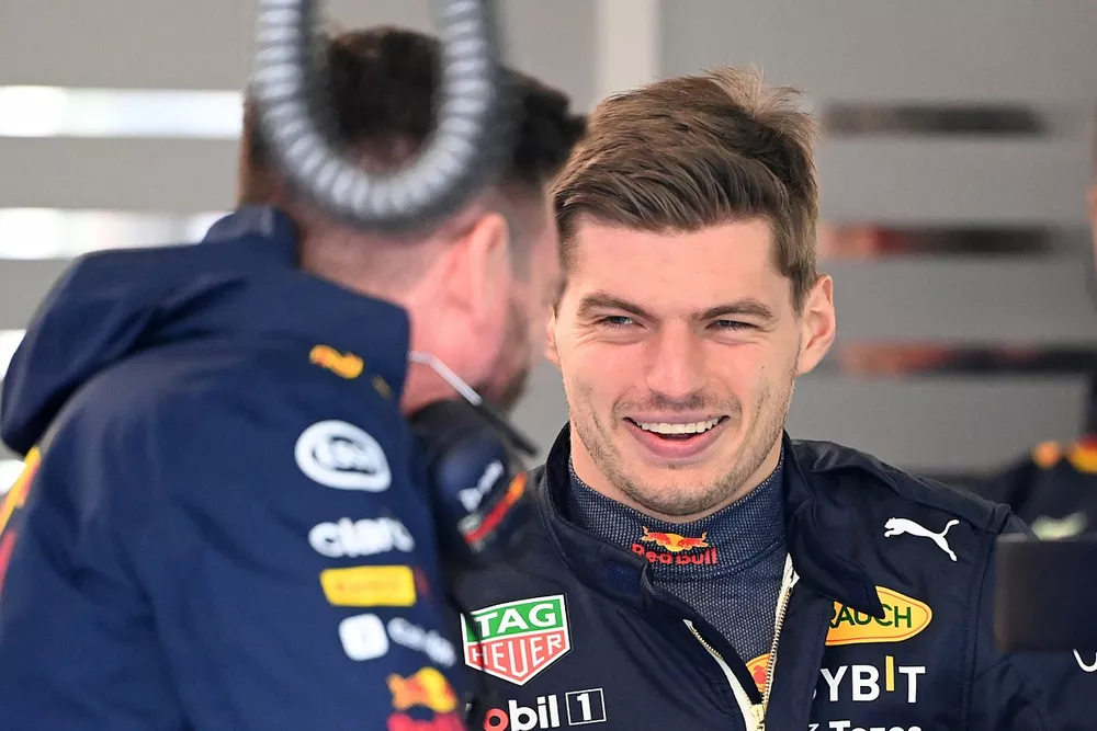Max Verstappen, Red Bull Racing, in the garage with mechanics