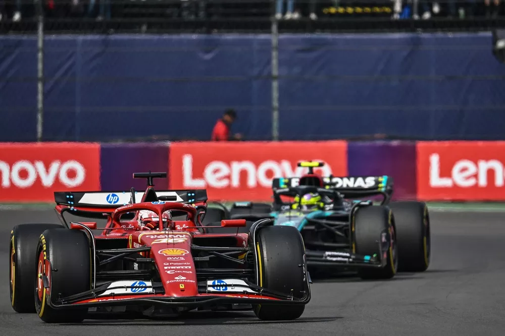 Charles Leclerc, Ferrari SF-24, leads Lewis Hamilton, Mercedes F1 W15