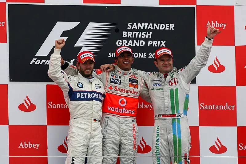 Podium: second place Nick Heidfeld, BMW Sauber F1, Race winner Lewis Hamilton, McLaren, third place Rubens Barrichello, Honda Racing F1 Team