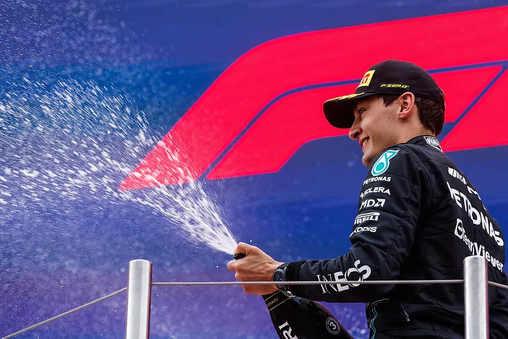 George Russell, Mercedes-AMG, 3rd position, sprays Champagne on the podium