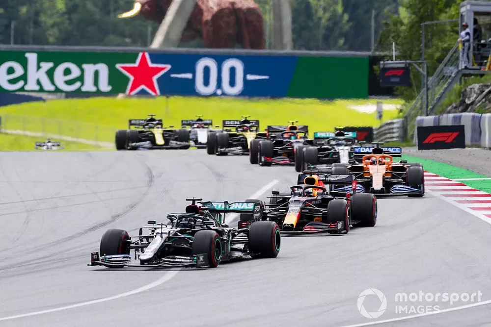 Lewis Hamilton, Mercedes F1 W11 EQ Performance, leads Max Verstappen, Red Bull Racing RB16, Carlos Sainz Jr., McLaren MCL35, Valtteri Bottas, Mercedes F1 W11 EQ Performance, and Alex Albon, Red Bull Racing RB16, at the start