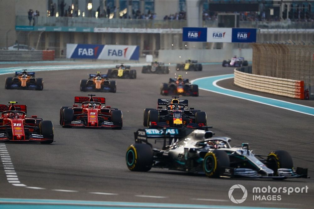 Lewis Hamilton, Mercedes AMG F1 W10, leads Charles Leclerc, Ferrari SF90, Sebastian Vettel, Ferrari SF90, Max Verstappen, Red Bull Racing RB15, and the rest of the field on the opening lap