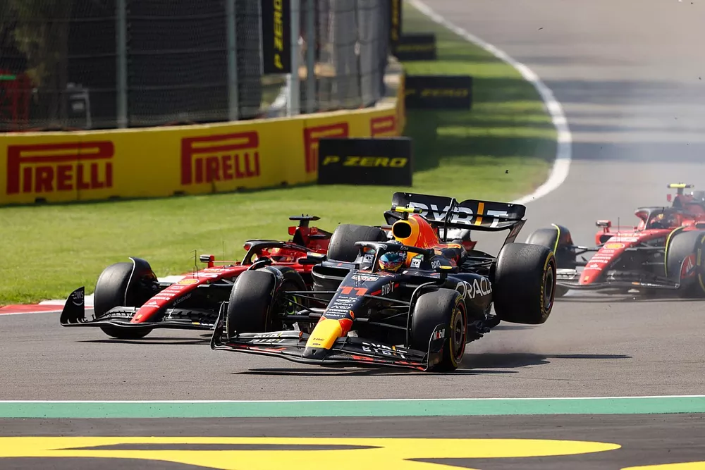 Sergio Perez, Red Bull Racing RB19, Charles Leclerc, Ferrari SF-23, collide at the start causing retirement for the Mexican