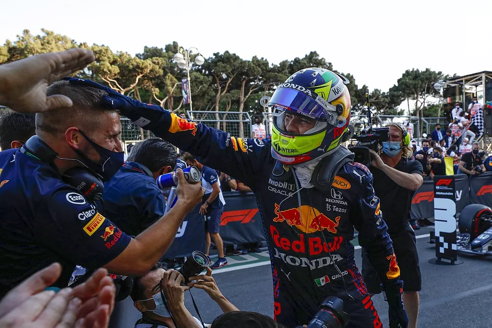 Sergio Perez, Red Bull Racing, 1st position, celebrates on arrival in Parc Ferme