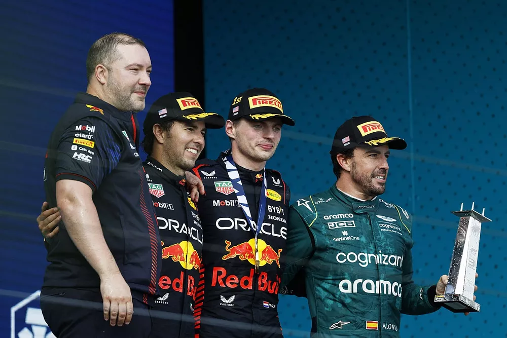 Podium: race winner Max Verstappen, Red Bull Racing, second place Sergio Perez, Red Bull Racing, third place Fernando Alonso, Aston Martin F1 Team, and Oliver Hughes, Chief Marketing Officer at Red Bull Racing 