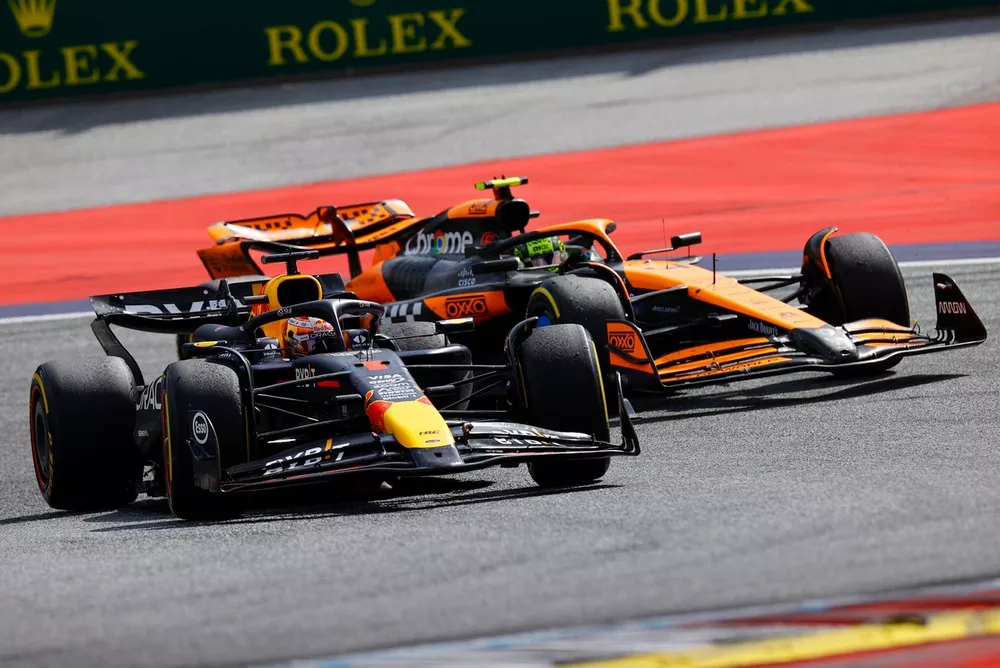 Max Verstappen, Red Bull Racing RB20, battles with Lando Norris, McLaren MCL38