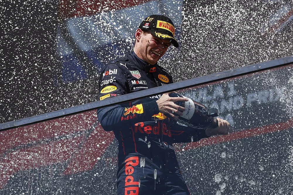 Max Verstappen, Red Bull Racing, 1st position, sprays champagne on the podium