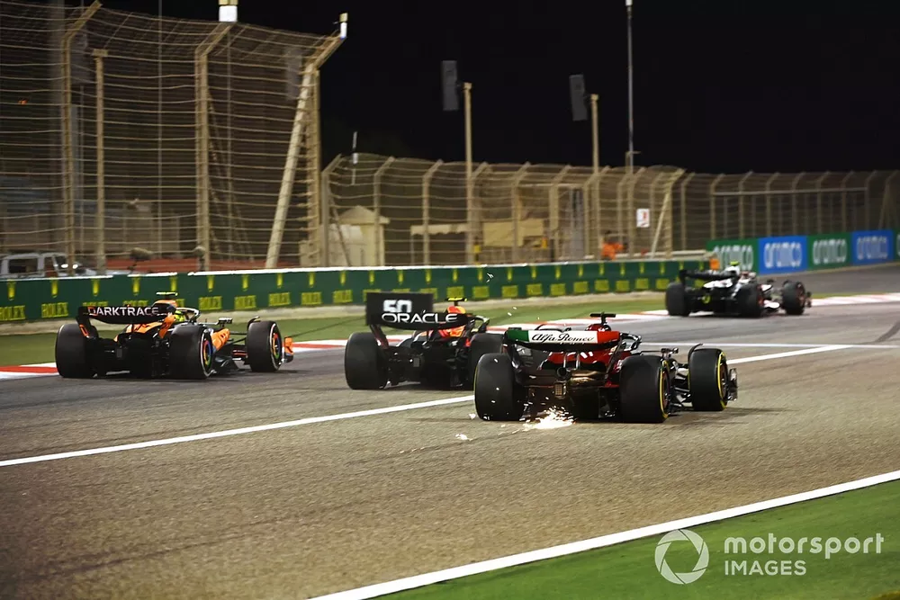 Lando Norris, McLaren MCL60, Sergio Perez, Red Bull Racing RB19, followed by Valtteri Bottas, Alfa Romeo C43, during a practice start