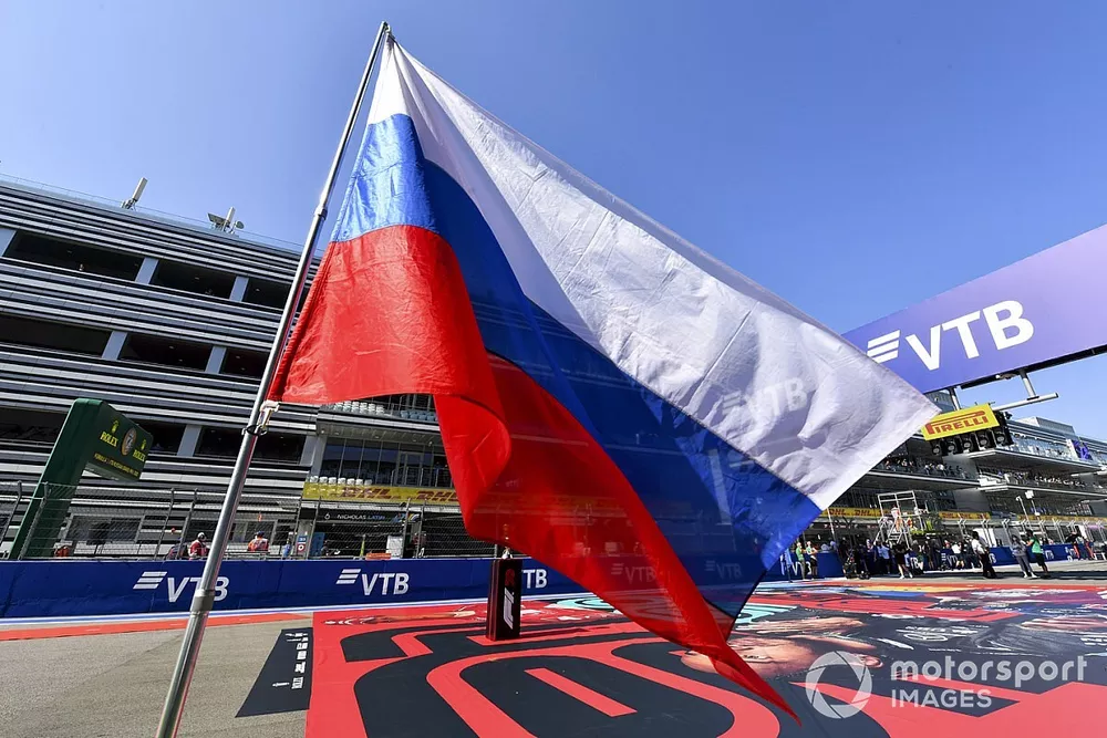The Russian flag is flown on the grid prior to the start
