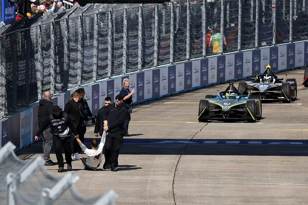 Protestors climbing onto the track