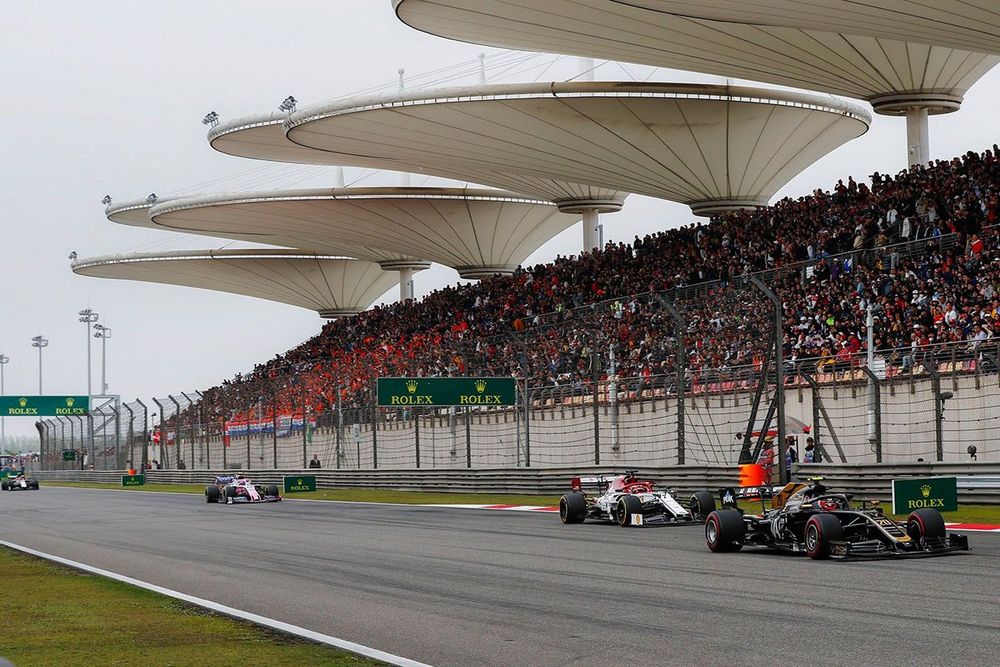 Kevin Magnussen, Haas F1 Team VF-19, leads Kimi Raikkonen, Alfa Romeo Racing C38, and Lance Stroll, Racing Point RP19