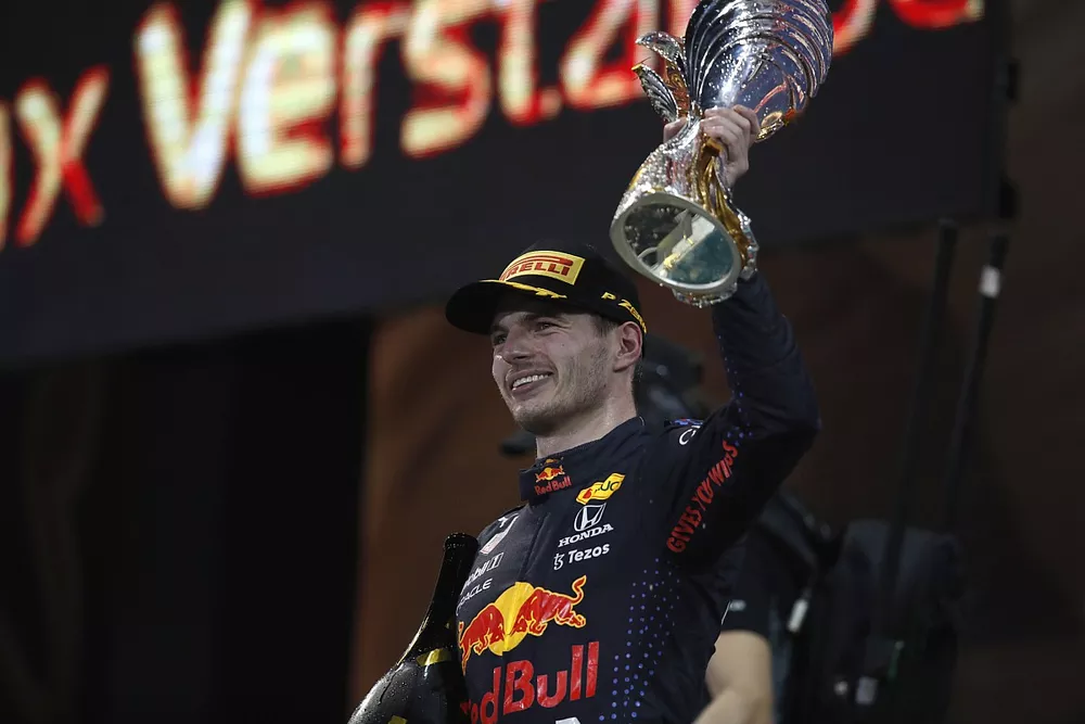 Max Verstappen, Red Bull Racing, 1st position, lifts his trophy on the podium