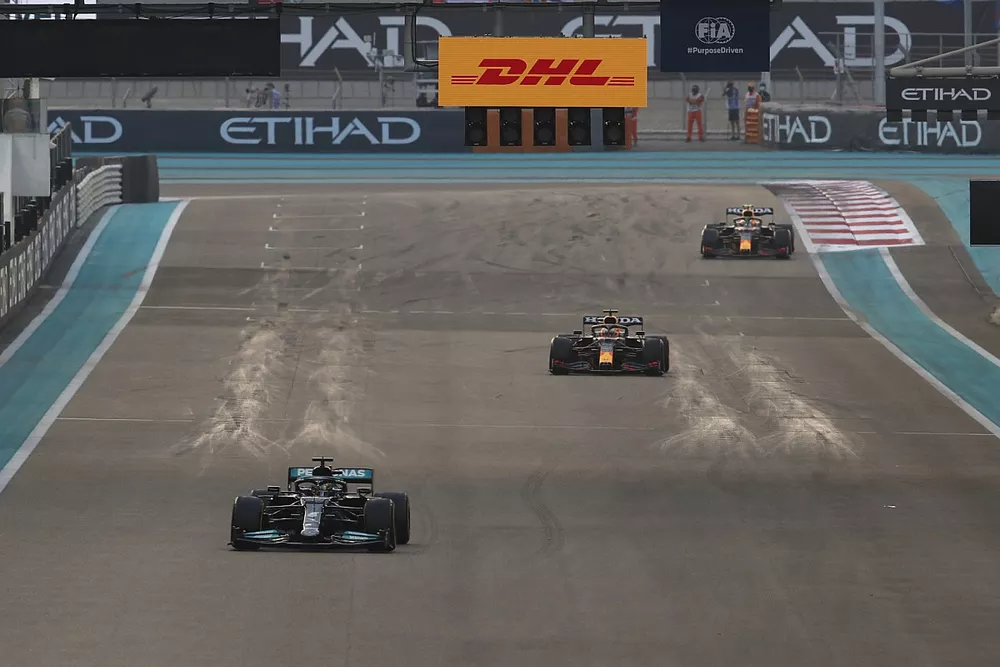 Lewis Hamilton, Mercedes W12, leadsMax Verstappen, Red Bull Racing RB16B, Sergio Perez, Red Bull Racing RB16B