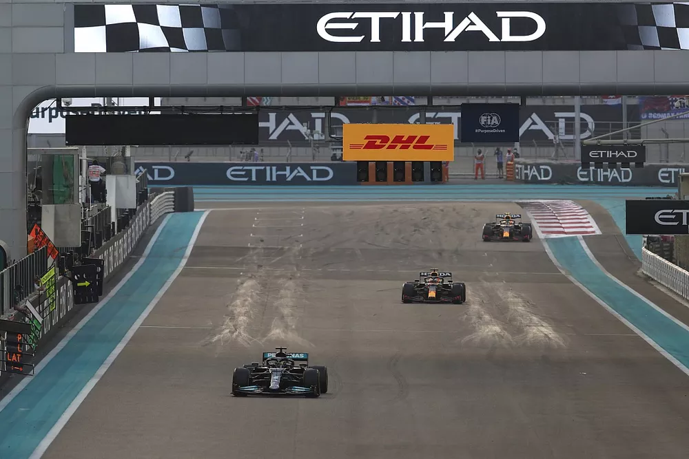 Lewis Hamilton, Mercedes W12, leadsMax Verstappen, Red Bull Racing RB16B, Sergio Perez, Red Bull Racing RB16B