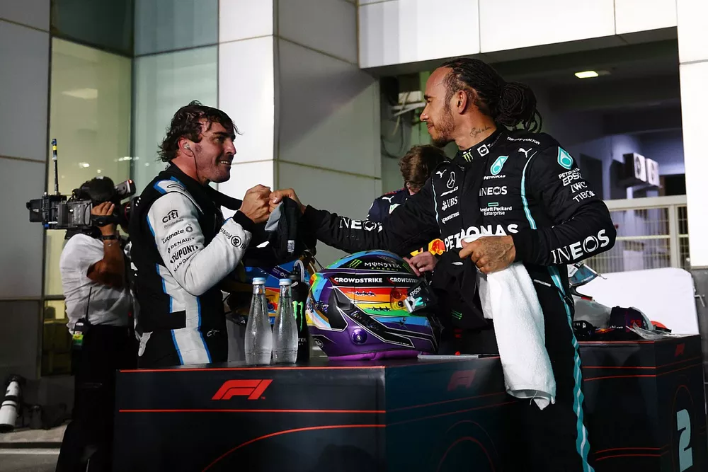 Fernando Alonso, Alpine F1, 3rd position, and Lewis Hamilton, Mercedes, 1st position, congratulate each other in Parc Ferme
