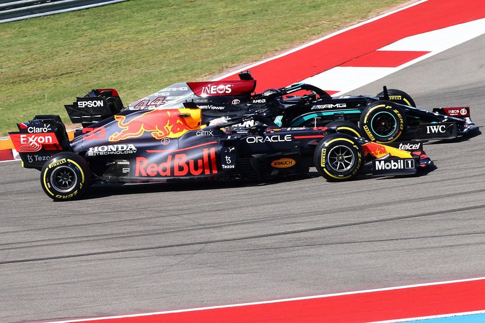 Max Verstappen, Red Bull Racing RB16B, battles with Lewis Hamilton, Mercedes W12, at the start