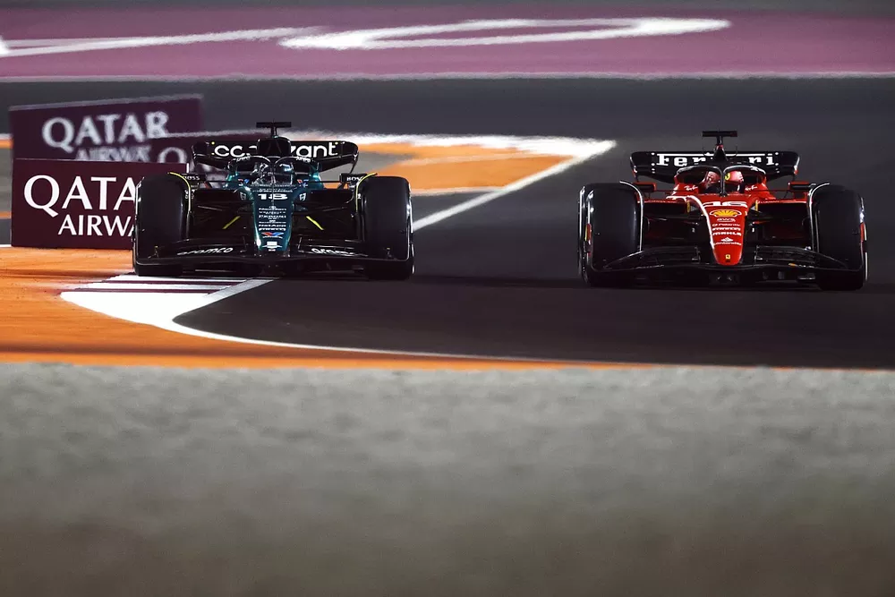 Lance Stroll, Aston Martin AMR23, battles with Charles Leclerc, Ferrari SF-23
