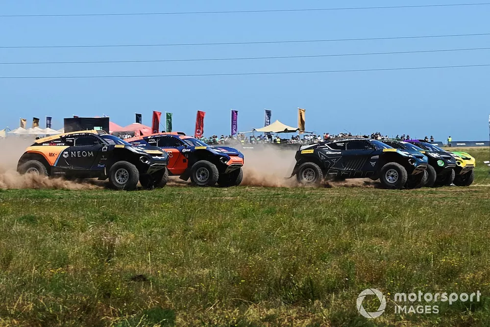 The race gets underway with Klara Andersson, Nasser Al-Attiyah, Abt Cupra XE, leading, followed by Molly Taylor, Kevin Hansen, Veloce Racing, Cristina Gutierrez, Sebastien Loeb, Team X44, Catie Munnings, Timmy Hansen, Genesys Andretti United Extreme E, an
