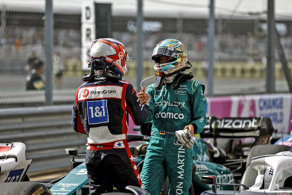 Kevin Magnussen, Haas F1 Team, Sebastian Vettel, Aston Martin, talk in Parc Ferme after the race