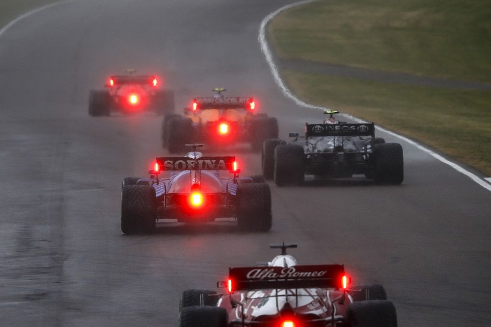 Lando Norris, McLaren MCL35M, Valtteri Bottas, Mercedes W12, and George Russell, Williams FW43B