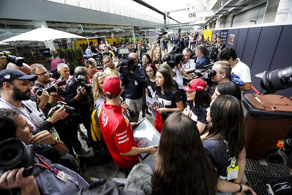 Sebastian Vettel, Ferrari with fans in the paddck