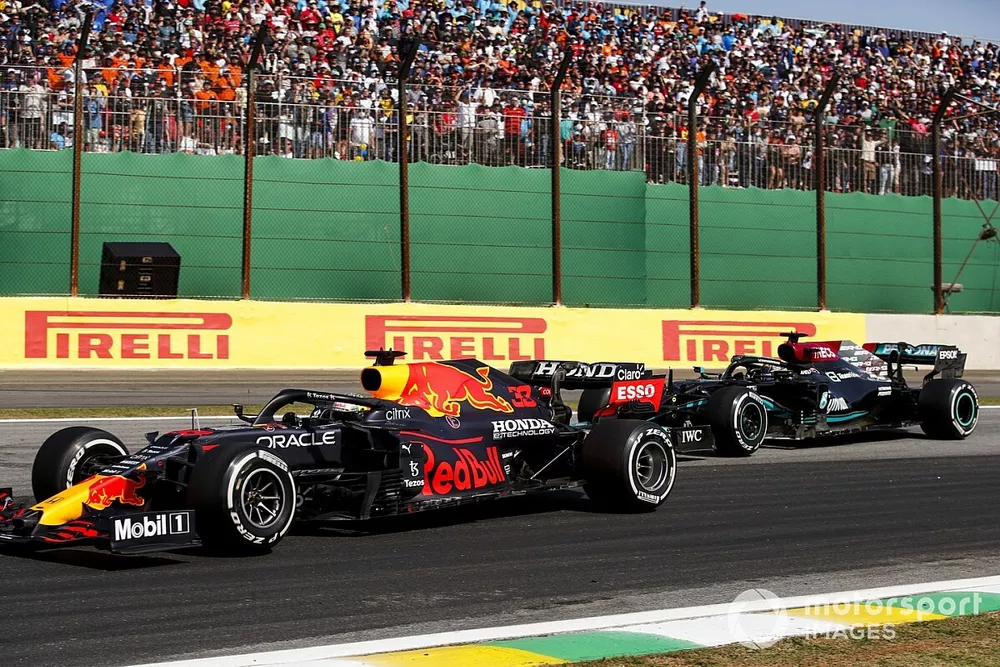 Max Verstappen, Red Bull Racing RB16B, battles with Lewis Hamilton, Mercedes W12