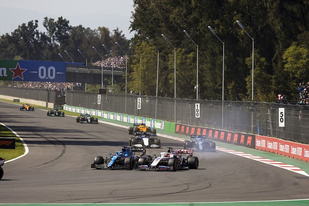 Fernando Alonso, Alpine A521, battles with Nikita Mazepin, Haas VF-21