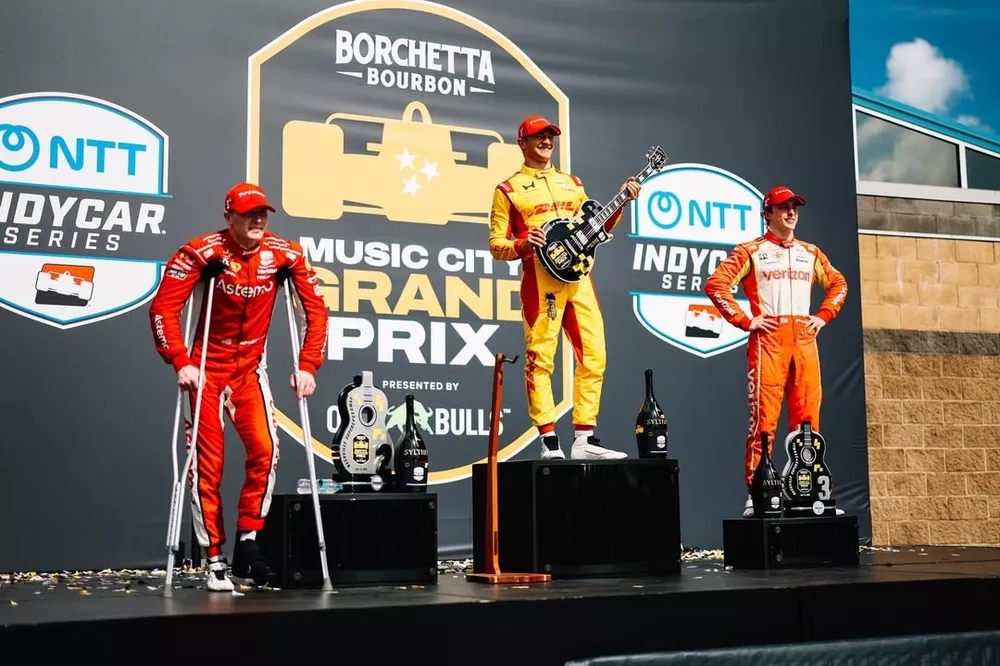Alex Palou (middle), Josef Newgarden (left), and David Malukas (right) on podium
