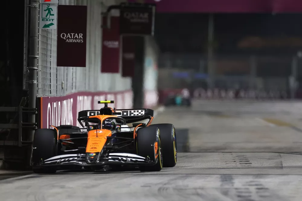 Lando Norris, McLaren MCL38, leads Max Verstappen, Red Bull Racing RB20