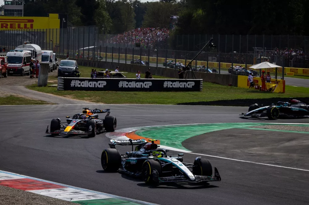 Sir Lewis Hamilton, Mercedes F1 W15, leads Max Verstappen, Red Bull Racing RB20