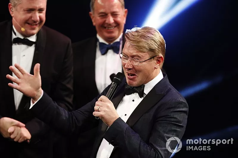 Mika Hakkinen receives a Gregor Grant Award on stage