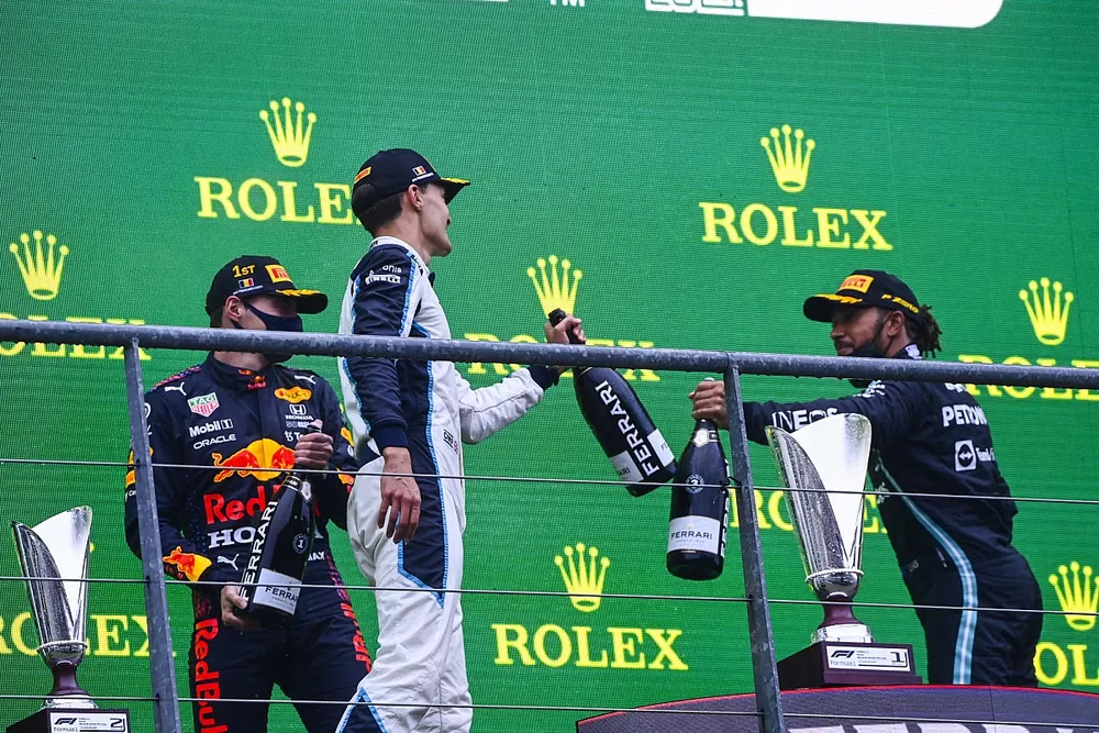 George Russell, Williams, 2nd position, and Lewis Hamilton, Mercedes, 3rd position, congratulate each other on the podium