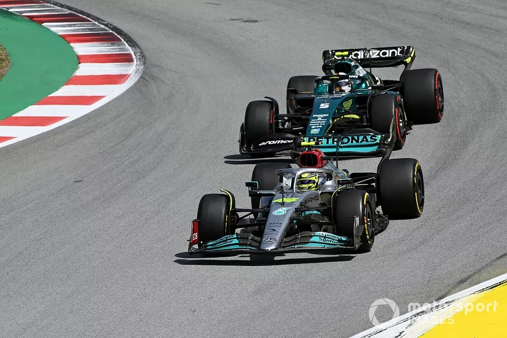 Sir Lewis Hamilton, Mercedes W13, leads Sebastian Vettel, Aston Martin AMR22