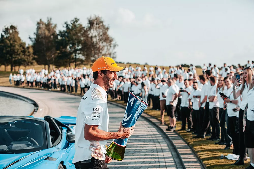 Daniel Ricciardo, McLaren celebrates with team members