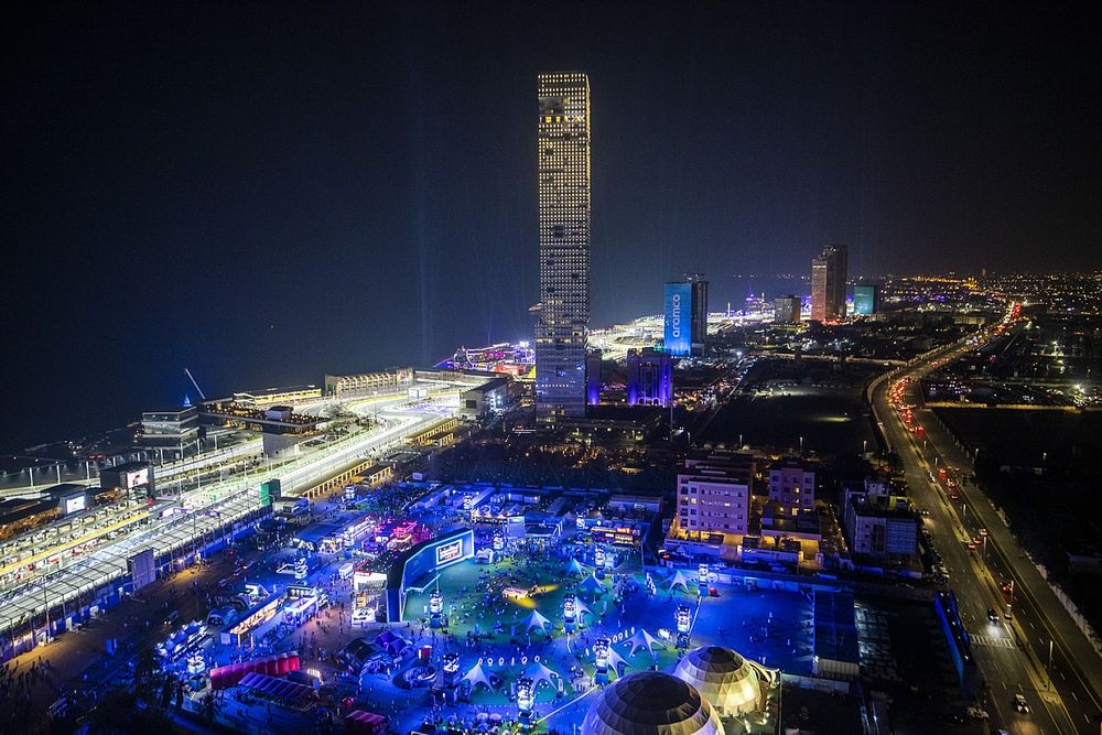 An aerial view of the circuit and city at night